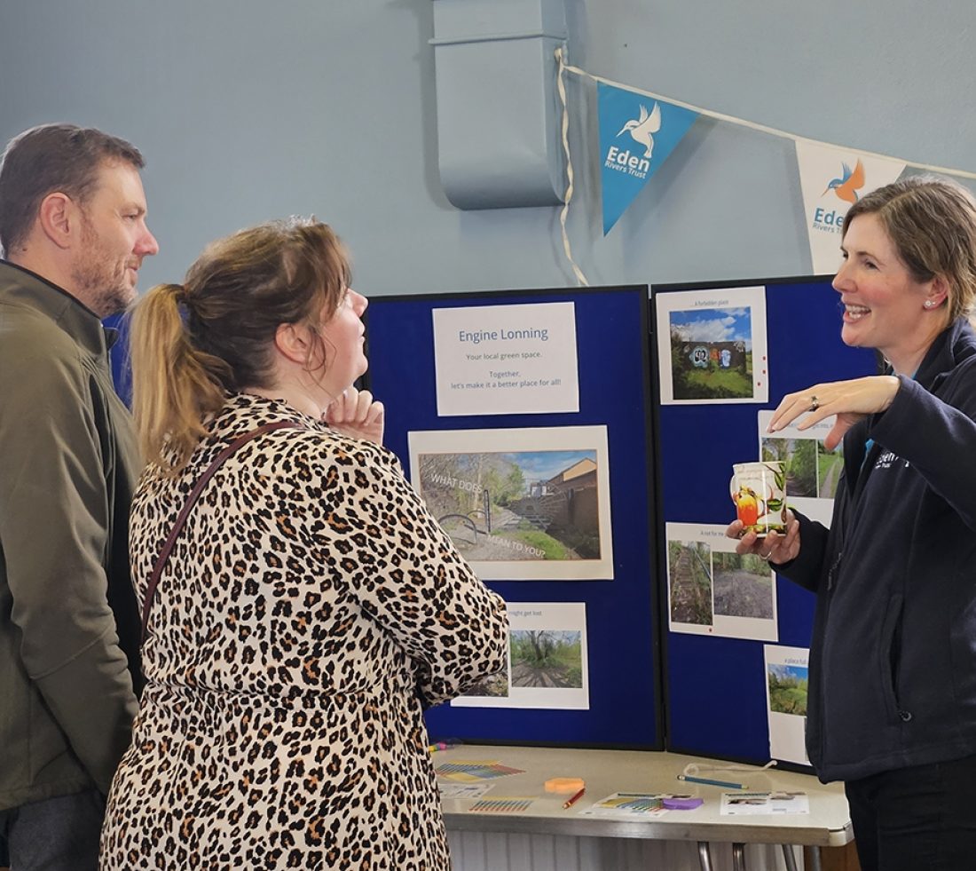 Two visitors to a consultation event speaking with an ERT member of staff.