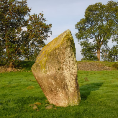 Mayburgh Henge - a tooth-shaped stone standing on its own in a field.