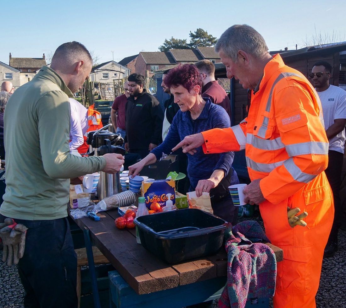 Volunteers organising tea and cake during a tea break at the Penrith community tree nursery.