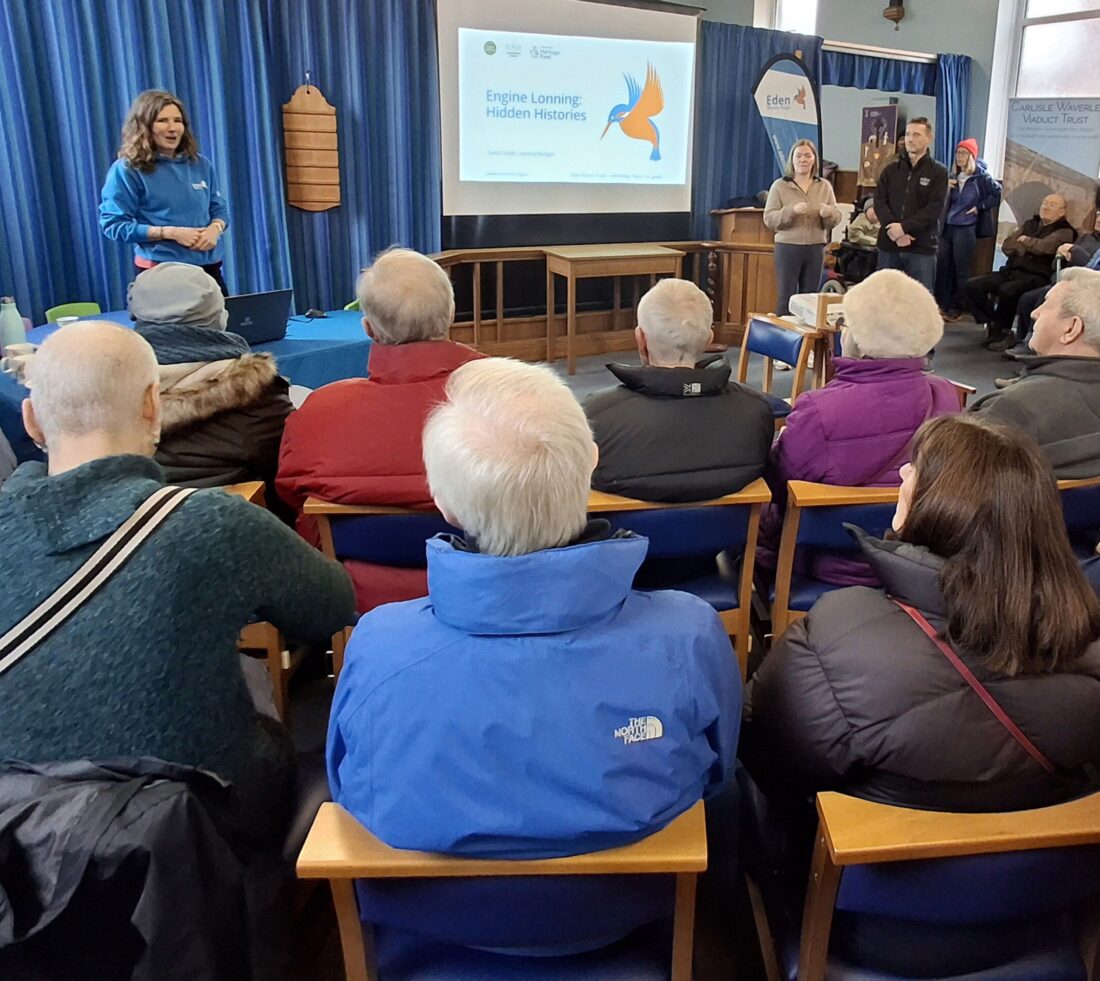 Audience at a community hall listening to a presentation given at an Engine Lonning community event discussing plans for the Access to Eden doorstep site.