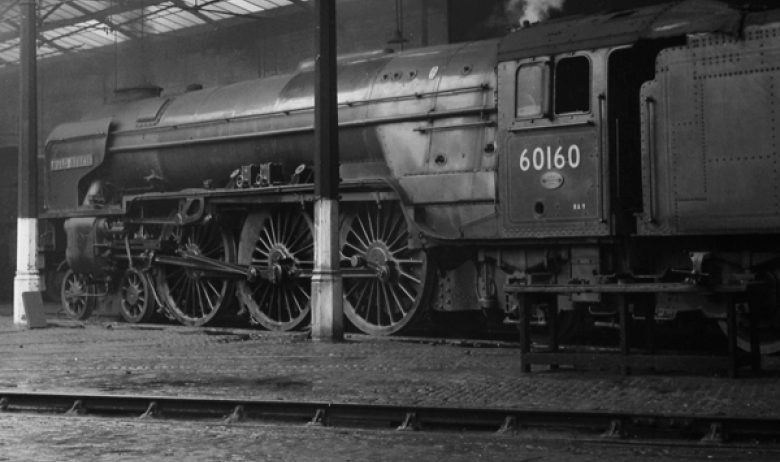 A large steam engine sat within an engine shed at Engine Lonning. Former site of a substantial train engine yard.