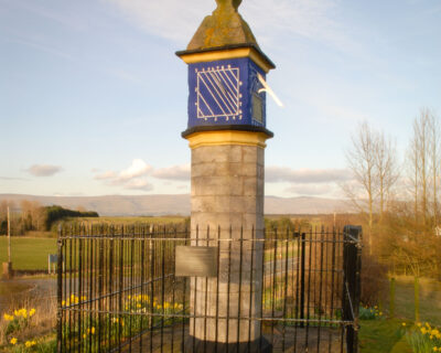 A tall, decorated pillar made of brick.