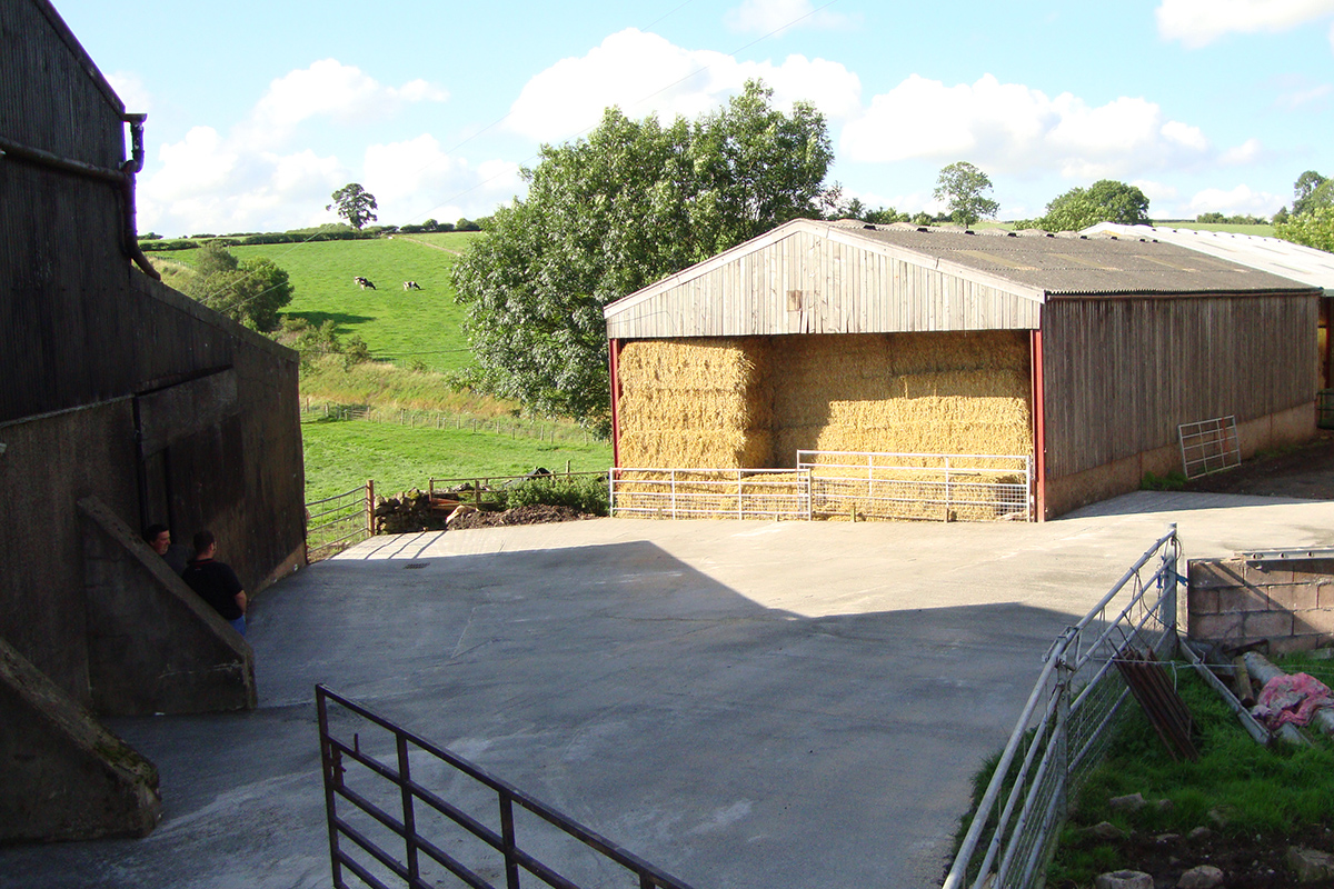 clean farmyard with covered silage barn