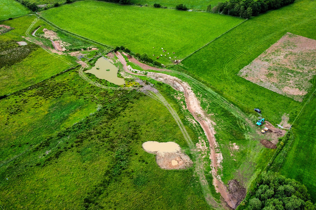 Can see ponds and scrapes (small ponds) and two disconnected wiggling river channels waiting to be connected,